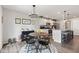 Bright breakfast nook open to the kitchen with round table and chandelier at 19387 Astoria Ave, Sheridan, IN 46069