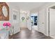 Stylish entryway showcasing dark hardwood flooring and an decorative mirror at 19387 Astoria Ave, Sheridan, IN 46069