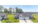 Aerial view of the home showing the driveway, garage, and landscaping at 19387 Astoria Ave, Sheridan, IN 46069