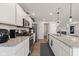 Lovely kitchen design includes white cabinets, stainless appliances, granite countertops and gas range at 19387 Astoria Ave, Sheridan, IN 46069