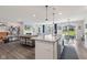 Open floor plan with kitchen island, breakfast nook, and view to the comfortable living room at 19387 Astoria Ave, Sheridan, IN 46069