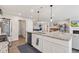 Beautiful kitchen with granite countertops and a view into the home's living room at 19387 Astoria Ave, Sheridan, IN 46069