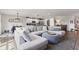 Spacious living room with hardwood floors, gray sectional, and an open floorplan at 19387 Astoria Ave, Sheridan, IN 46069