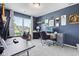 A home office featuring an eye test chart on the wall, two desks, and a window at 19387 Astoria Ave, Sheridan, IN 46069