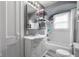 The bathroom offers a tiled shower and bath, with vanity and commode at 1944 Union St, Columbus, IN 47201