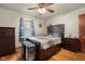 This is a bedroom featuring hardwood floors and a wooden bedroom set with blue accents at 1944 Union St, Columbus, IN 47201