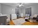 A bedroom boasts hardwood floors, and a ceiling fan at 1944 Union St, Columbus, IN 47201