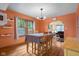 Cozy dining room with hardwood floors and orange walls at 1944 Union St, Columbus, IN 47201