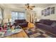 Comfortable living room showcasing hardwood floors, ceiling fan, and natural lighting at 1944 Union St, Columbus, IN 47201