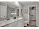 Elegant bathroom with double sink vanity, a large mirror, and a separate shower area at 19791 Moorpark Lndg, Noblesville, IN 46062
