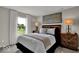 Stylish bedroom with a comfortable bed, bright window, and modern decor, perfect for relaxation at 19791 Moorpark Lndg, Noblesville, IN 46062