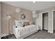 Cozy bedroom featuring a white daybed, stylish lighting, and modern decor elements at 19791 Moorpark Lndg, Noblesville, IN 46062