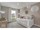 Charming bedroom with white daybed, decorative pillows, and sheer curtains, creating a dreamy space at 19791 Moorpark Lndg, Noblesville, IN 46062