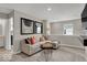 Comfortable loft area with a plush sectional sofa, stylish decor, and a mounted television at 19791 Moorpark Lndg, Noblesville, IN 46062