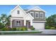 Charming two-story home with brick and gray siding, a covered entry, and an attached two-car garage at 19820 Moorpark Lndg, Noblesville, IN 46062