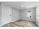 Clean bedroom featuring light colored walls, hardwood floors, and a bright window at 1993 Mulberry St, Noblesville, IN 46060