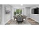 Bright dining room featuring a large window, stylish furniture, and modern decor at 1993 Mulberry St, Noblesville, IN 46060