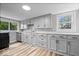 Well-lit kitchen featuring sleek countertops, ample storage, and modern appliances at 1993 Mulberry St, Noblesville, IN 46060