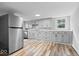 Bright kitchen with modern countertops, appliances, and new stainless refrigerator at 1993 Mulberry St, Noblesville, IN 46060