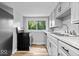 Modern kitchen with stainless steel appliances and an oversized window at 1993 Mulberry St, Noblesville, IN 46060