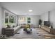 Spacious living room featuring large windows, stylish furniture, and contemporary decor at 1993 Mulberry St, Noblesville, IN 46060