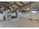 Unfinished basement showing exposed beams, utilities and concrete floor at 2245 N Ritter Ave, Indianapolis, IN 46218