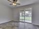 Bedroom with tile floors and sliding glass doors overlooking backyard at 2245 N Ritter Ave, Indianapolis, IN 46218