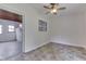 Bedroom with tile floor, ceiling fan and a view of sun room at 2245 N Ritter Ave, Indianapolis, IN 46218