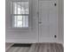Interior shot of the front door with vinyl flooring and a window at 2245 N Ritter Ave, Indianapolis, IN 46218