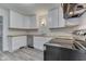 Bright kitchen featuring new stainless appliances, light countertops, and shaker cabinets at 2245 N Ritter Ave, Indianapolis, IN 46218