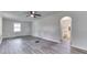 Bright living room with neutral walls, a ceiling fan, and vinyl flooring at 2245 N Ritter Ave, Indianapolis, IN 46218