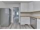 Open concept kitchen featuring new appliances, shaker cabinets with access to living room at 2245 N Ritter Ave, Indianapolis, IN 46218