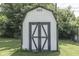 Close-up of the storage shed with black cross-buck door and a vent at 2245 N Ritter Ave, Indianapolis, IN 46218