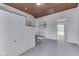 Sun room with white brick, wood plank ceiling and access door at 2245 N Ritter Ave, Indianapolis, IN 46218