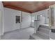 Sun room with brick wall and wood plank ceiling with access doors at 2245 N Ritter Ave, Indianapolis, IN 46218