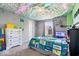 Fun bedroom with unique ceiling decor, soft carpeting, and playful accents at 2426 Autumn Rd, Indianapolis, IN 46229