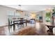Inviting dining area showcasing a stylish light fixture and a view of the front yard at 2426 Autumn Rd, Indianapolis, IN 46229