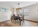 Inviting dining area featuring modern light fixture and stylish floors at 2426 Autumn Rd, Indianapolis, IN 46229