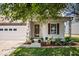 Charming home featuring a covered porch and landscaping at 2426 Autumn Rd, Indianapolis, IN 46229