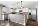 Bright kitchen featuring white cabinets, stainless steel appliances, and decorative tile backsplash at 2426 Autumn Rd, Indianapolis, IN 46229