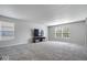 Spacious living room offers neutral colors, plush carpeting, and abundant natural light at 2426 Autumn Rd, Indianapolis, IN 46229