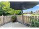 Outdoor patio area with privacy fence and lush landscaping at 2717 Reflection Way, Greenwood, IN 46143