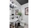 Elegant bathroom featuring a pedestal sink, modern fixtures, and tasteful decorations at 2717 Reflection Way, Greenwood, IN 46143