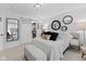 Bright bedroom with a comfortable bed, stylish decor, and sliding door to closet at 2717 Reflection Way, Greenwood, IN 46143
