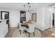 Charming dining area with round table, plush rug, and elegant display cabinet at 2717 Reflection Way, Greenwood, IN 46143
