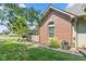 Exterior of brick home with manicured lawn, landscaping, and patio area at 2717 Reflection Way, Greenwood, IN 46143