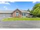 Charming home featuring brick accents, well-manicured lawn, and attached garage at 2717 Reflection Way, Greenwood, IN 46143