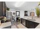 Open kitchen featuring stainless steel appliances, dark cabinetry, and modern countertops at 2717 Reflection Way, Greenwood, IN 46143
