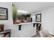 Bright eat-in kitchen featuring a breakfast bar, stainless appliances, and modern decor at 2717 Reflection Way, Greenwood, IN 46143