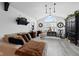 Bright living room featuring vaulted ceilings, stylish lighting, and comfortable seating at 2717 Reflection Way, Greenwood, IN 46143